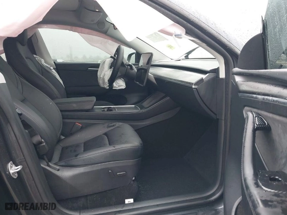2024 Tesla Model Y with VIN 7SAYGDED8RF213927, listed as a IAAI auction lot 41386687 with 3,599 mi miles. Bid and sale history available at carsss.com. Image 5.
