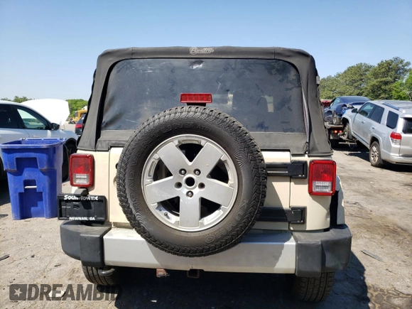 2011 Jeep Wrangler Sahara z VIN 1J4AA5D10BL528862, wystawiony jako Copart lot #53488515 z przebiegiem 198 865 mil mil oraz Szkoda całkowita • Salvage title. Historia ofert i sprzedaży dostępna na DreamBid. Obrazek 6.