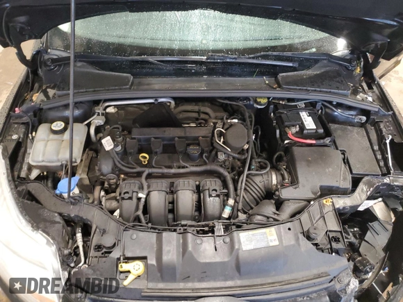 2012 Ford Focus SE z VIN 1FAHP3K24CL407570, wystawiony jako Copart lot #56002135 z przebiegiem 122 730 mil mil oraz Szkoda całkowita • Salvage title. Historia ofert i sprzedaży dostępna na DreamBid. Obrazek 11.