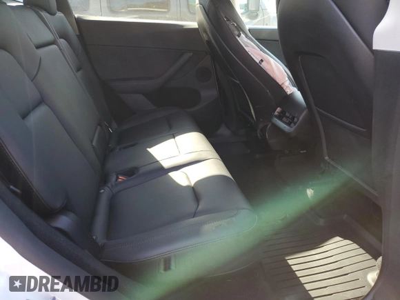 2023 Tesla Model Y Long Range z VIN 7SAYGDEE5PF785124, wystawiony jako Copart lot #56553785 z przebiegiem 31 341 mil mil oraz Szkoda całkowita • Salvage title. Historia ofert i sprzedaży dostępna na DreamBid. Obrazek 10.