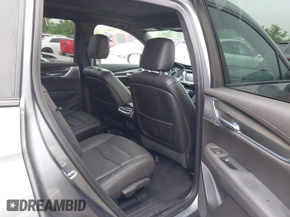 2021 Cadillac XT6 Sport with VIN 1GYKPGRS6MZ128112, listed as a IAAI auction lot 42415342 with 57,680 mi miles and . Bid and sale history available at DreamBid. Image 8.