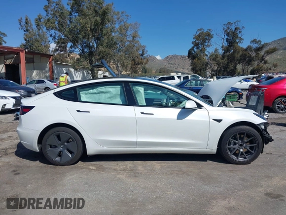 2023 Tesla Model 3 with VIN 5YJ3E1EA4PF462627, listed as a IAAI auction lot 41750103 with 38,463 mi miles and . Bid and sale history available at carsss.com. Image 13.
