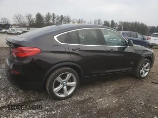 2015 BMW X4 xDrive28i with VIN 5UXXW3C55F0M88228, listed as a Copart auction lot 82940173 with 73,519 mi miles. Bid and sale history available at carsss.com. Image 3.