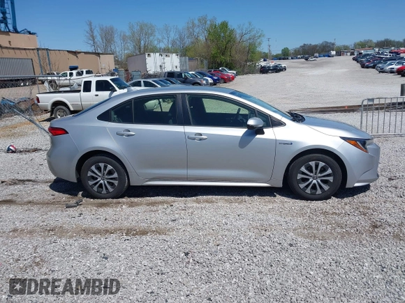 2021 Toyota Corolla Hybrid LE with VIN JTDEAMDE5MJ022110, listed as a IAAI auction lot 41912920 with 59,198 mi miles. Bid and sale history available at carsss.com. Image 13.