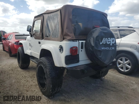 2001 Jeep Wrangler Sahara with VIN 1J4FA59S31P334308, listed as a Copart auction lot 77984464 with 116,293 mi miles and Salvage Title. Bid and sale history available at carsss.com. Image 2.