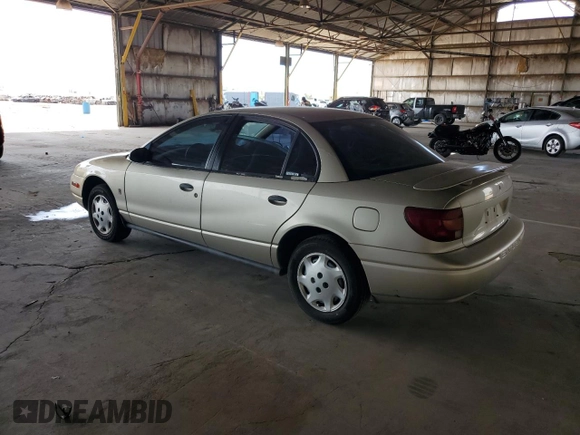 2002 Saturn SL z VIN 1G8ZH52842Z165459, wystawiony jako Copart lot #57273035 z przebiegiem 84 482 mil mil oraz Szkoda całkowita • Salvage title. Historia ofert i sprzedaży dostępna na DreamBid. Obrazek 2.