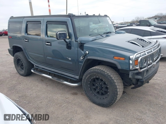 2005 Hummer H2 SUV z VIN 5GRGN23U95H100888, wystawiony jako IAAI lot #41937351 z przebiegiem 202 969 mil mil oraz . Historia ofert i sprzedaży dostępna na DreamBid. Obrazek 1.