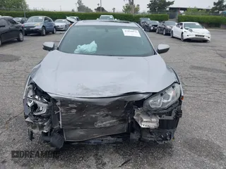 2018 Honda Civic Si with VIN 2HGFC1E50JH708274, listed as a IAAI auction lot 42034872 with 48,551 mi miles and . Bid and sale history available at DreamBid. Image 12.