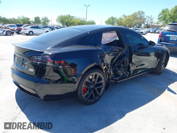 2023 Tesla Model S Plaid with VIN 5YJSA1E67PF528171, listed as a IAAI auction lot 41831086 with Not provided miles and . Bid and sale history available at DreamBid. Image 4.