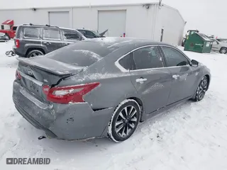 2018 Nissan Altima 2.5 SV with VIN 1N4AL3AP0JC136949, listed as a IAAI auction lot 41572923 with 69,000 mi miles. Bid and sale history available at carsss.com. Image 4.