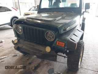 2000 Jeep Wrangler Sport with VIN 1J4FA49S8YP780104, listed as a IAAI auction lot 42095731 with Not provided miles and . Bid and sale history available at DreamBid. Image 12.