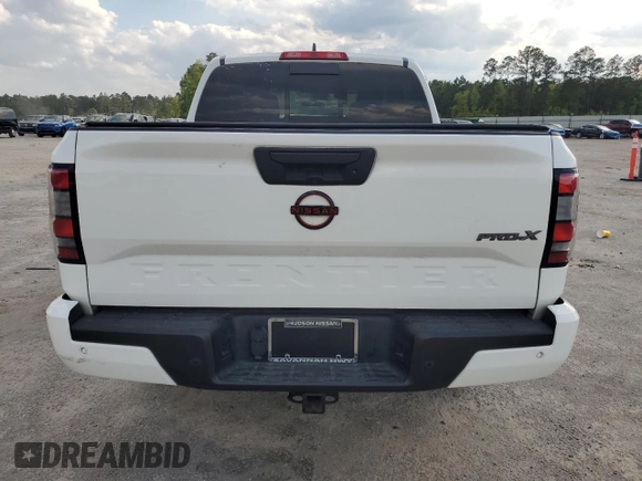 2023 Nissan Frontier Pro-X with VIN 1N6ED1EJ6PN661933, listed as a Copart auction lot 52496135 with 28,533 mi miles and Salvage title. Bid and sale history available at DreamBid. Image 6.