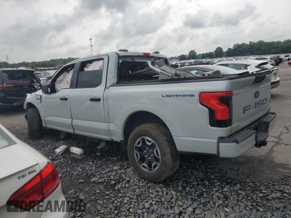 2023 Ford F-150 Lightning Pro with VIN 1FTVW1EL9PWG58758, listed as a Copart auction lot 64410814 with Not provided miles and Salvage title. Bid and sale history available at DreamBid. Image 2.