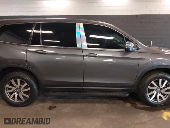 2022 Honda Pilot EX-L with VIN 5FNYF6H59NB000754, listed as a IAAI auction lot 42090576 with 32,813 mi miles and . Bid and sale history available at DreamBid. Image 13.