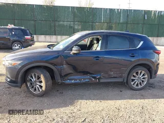 2020 Mazda CX-5 Grand Touring with VIN JM3KFBDM4L0779284, listed as a IAAI auction lot 42060936 with 9,227 mi miles. Bid and sale history available at carsss.com. Image 14.