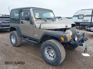 2004 Jeep Wrangler Rubicon z VIN 1J4FA69S24P758685, wystawiony jako IAAI lot #42167956 z przebiegiem 73 129 mil mil oraz . Historia ofert i sprzedaży dostępna na DreamBid. Obrazek 1.