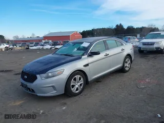 2014 Ford Sedan Police Interceptor with VIN 1FAHP2MK6EG153699, listed as a IAAI auction lot 41397473 with 174,452 mi miles. Bid and sale history available at carsss.com. Image 17.