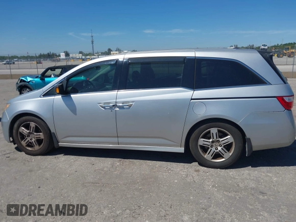 2012 Honda Odyssey Touring with VIN 5FNRL5H90CB099519, listed as a IAAI auction lot 41854550 with 185,110 mi miles. Bid and sale history available at carsss.com. Image 15.