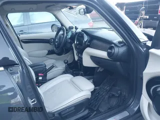 2016 MINI Cooper Hardtop 4 Door S with VIN WMWXU3C56G2B63682, listed as a IAAI auction lot 41244676 with 110,902 mi miles. Bid and sale history available at carsss.com. Image 5.