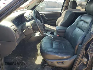 2004 Jeep Grand Cherokee Laredo with VIN 1J4GW48S34C343281, listed as a Copart auction lot 63253325 with 247,697 mi miles and Clean title. Bid and sale history available at DreamBid. Image 7.