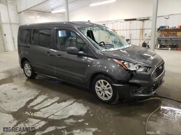 2021 Ford Transit Connect Wagon XLT with VIN NM0GE9F27M1491399, listed as a Copart auction lot 43619855 with 77,389 mi miles and Salvage Title. Bid and sale history available at carsss.com. Image 4.