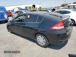 2010 Honda Insight LX with VIN JHMZE2H59AS041185, listed as a Copart auction lot 64517415 with 208,242 mi miles and Salvage title. Bid and sale history available at DreamBid. Image 2.