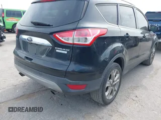 2014 Ford Escape Titanium with VIN 1FMCU0JX5EUB43194, listed as a IAAI auction lot 42084883 with 71,819 mi miles. Bid and sale history available at carsss.com. Image 4.