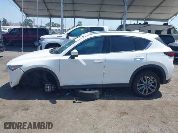 2020 Mazda CX-5 Grand Touring with VIN JM3KFADM9L0821930, listed as a IAAI auction lot 42549986 with 29,929 mi miles and . Bid and sale history available at DreamBid. Image 14.