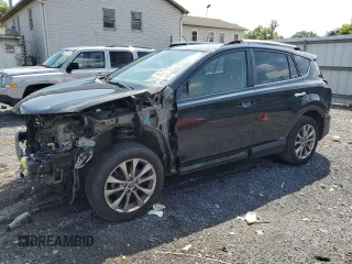 2016 Toyota RAV4 Limited with VIN JTMDJREV4GD021010, listed as a Copart auction lot 64437465 with 165,044 mi miles and Salvage title. Bid and sale history available at DreamBid. Image 1.