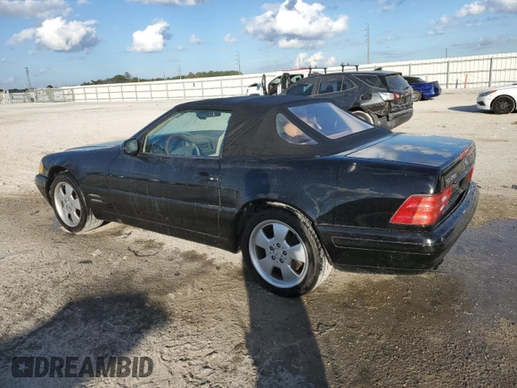 1999 Mercedes-Benz SL-Class with VIN WDBFA68F0XF186163, listed as a Copart auction lot 82669544 with 184,054 mi miles and Salvage Title. Bid and sale history available at carsss.com. Image 2.