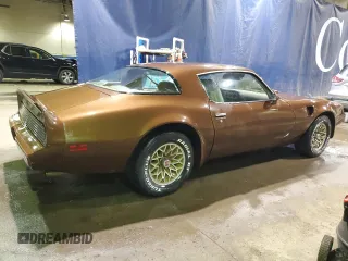 1979 Pontiac Firebird z VIN 2W87K9N184050, wystawiony jako Copart lot #75937874 z przebiegiem 18 509 mil mil oraz Szkody całkowita. Historia ofert i sprzedaży dostępna na DreamBid. Obrazek 3.