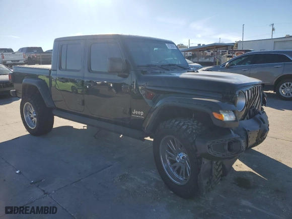 2023 Jeep Gladiator Overland with VIN 1C6HJTFG2PL559314, listed as a Copart auction lot 87530945 with 9,434 mi miles and Salvage Title. Bid and sale history available at carsss.com. Image 4.