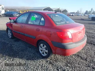 2009 Kia Rio LX with VIN KNADE223796485606, listed as a IAAI auction lot 41676881 with 58,852 mi miles and . Bid and sale history available at DreamBid. Image 3.