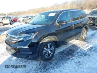 2016 Honda Pilot EX-L with VIN 5FNYF6H7XGB115951, listed as a IAAI auction lot 41642756 with 101,688 mi miles. Bid and sale history available at carsss.com. Image 2.