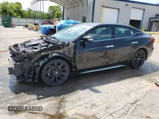 2017 Nissan Maxima SR with VIN 1N4AA6AP9HC363235, listed as a Copart auction lot 64017715 with 101,954 mi miles and Salvage title. Bid and sale history available at DreamBid. Image 1.