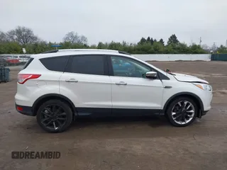 2016 Ford Escape SE z VIN 1FMCU9GX8GUA92661, wystawiony jako IAAI lot #41085877 z przebiegiem 76 632 mil mil oraz . Historia ofert i sprzedaży dostępna na DreamBid. Obrazek 13.