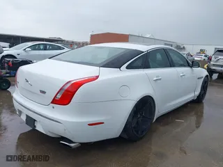 2012 Jaguar XJ with VIN SAJWA1CB7CLV35339, listed as a IAAI auction lot 41945850 with 123,501 mi miles. Bid and sale history available at carsss.com. Image 4.