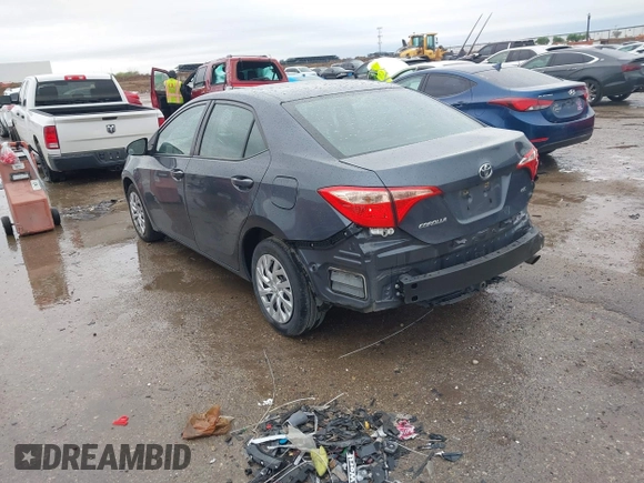 2019 Toyota Corolla L with VIN 5YFBURHE8KP873067, listed as a IAAI auction lot 41936471 with 75,076 mi miles and . Bid and sale history available at carsss.com. Image 3.