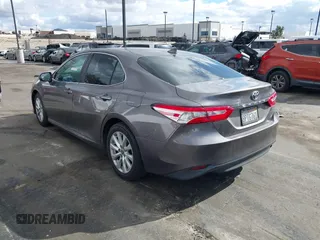 2020 Toyota Camry LE with VIN 4T1C11AK3LU363417, listed as a IAAI auction lot 41430382 with 130,837 mi miles. Bid and sale history available at carsss.com. Image 3.