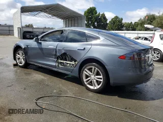 2013 Tesla Model S with VIN 5YJSA1CG9DFP09733, listed as a Copart auction lot 71574474 with 88,163 mi miles and Salvage title. Bid and sale history available at DreamBid. Image 2.