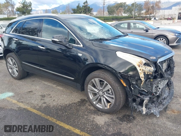 2024 Cadillac XT5 FWD Premium Luxury with VIN 1GYKNCRS6RZ745077, listed as a IAAI auction lot 41247248 with 3,302 mi miles. Bid and sale history available at carsss.com. Image 1.