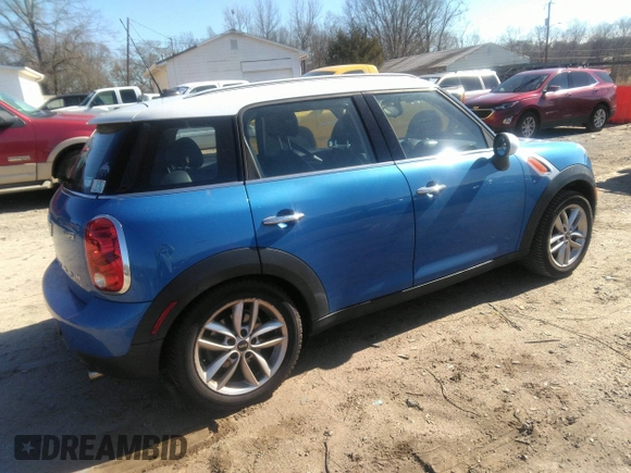 2013 MINI Cooper Countryman with VIN WMWZB3C56DWM31601, listed as a IAAI auction lot 41814031 with 139,417 mi miles. Bid and sale history available at carsss.com. Image 4.