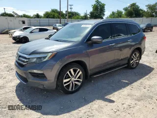 2016 Honda Pilot Elite with VIN 5FNYF6H02GB098887, listed as a Copart auction lot 62301315 with 127,386 mi miles and Salvage title. Bid and sale history available at DreamBid. Image 1.