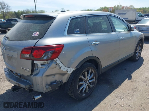 2014 Mazda CX-9 Grand Touring z VIN JM3TB3DV4E0429428, wystawiony jako IAAI lot #42094028 z przebiegiem 147 294 mil mil oraz . Historia ofert i sprzedaży dostępna na DreamBid. Obrazek 4.