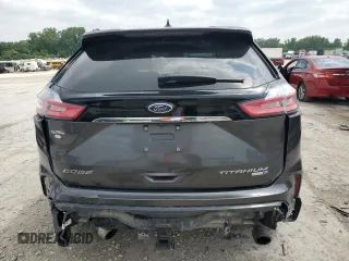 2020 Ford Edge Titanium с VIN 2FMPK4K97LBA11619, выставлен на аукционе Copart как лот 59505825 с пробегом 87 506 миль миль и Списание • Salvage title. История ставок и продаж доступна на DreamBid. Изображение 6.