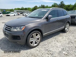 2013 Volkswagen Touareg Lux with VIN WVGEF9BP8DD002947, listed as a Copart auction lot 52590164 with 144,831 mi miles and Salvage Title. Bid and sale history available at DreamBid. Image 1.