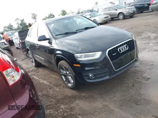 2015 Audi Q3 Premium Plus z VIN WA1EFCFS6FR001473, wystawiony jako IAAI lot #42795951 z przebiegiem 148 638 mil mil oraz . Historia ofert i sprzedaży dostępna na DreamBid. Obrazek 1.