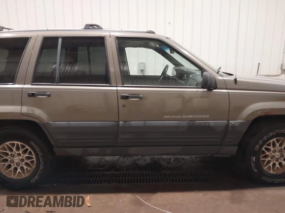 1996 Jeep Grand Cherokee Laredo with VIN 1J4GZ58S5TC182766, listed as a IAAI auction lot 41372356 with 234,390 mi miles. Bid and sale history available at carsss.com. Image 14.