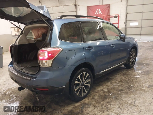 2017 Subaru Forester Touring with VIN JF2SJGTC9HH410251, listed as a IAAI auction lot 41411079 with 131,220 mi miles and . Bid and sale history available at DreamBid. Image 4.