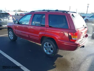 2004 Jeep Grand Cherokee Limited with VIN 1J8GW58N64C329504, listed as a IAAI auction lot 41785215 with 124,952 mi miles. Bid and sale history available at carsss.com. Image 3.